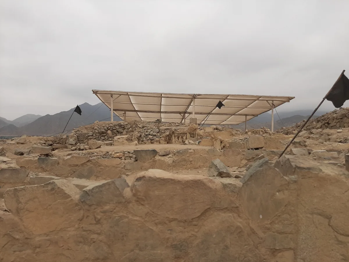 An earthen platform pyramid at Caral with a stone stairway